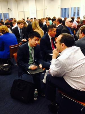 Room filled with people participating in mock interviews