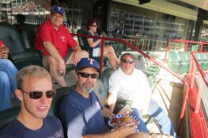  a few of the attendees sitting in the seats at the game