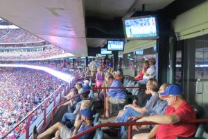 attendees sitting in the seats watching game