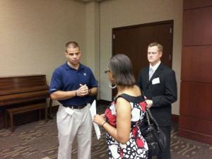 3 people standing and talking